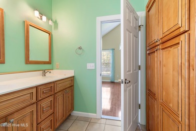 Experience coastal living in this charming 3-bedroom, 2-bath on Members Club At St. James Plantation in North Carolina - for sale on GolfHomes.com, golf home, golf lot