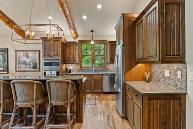 Elegant and distinctive, this Whispering Rock residence offers on Eagle Bend Golf Course in Montana - for sale on GolfHomes.com, golf home, golf lot