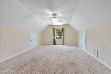 Experience coastal living in this charming 3-bedroom, 2-bath on Members Club At St. James Plantation in North Carolina - for sale on GolfHomes.com, golf home, golf lot