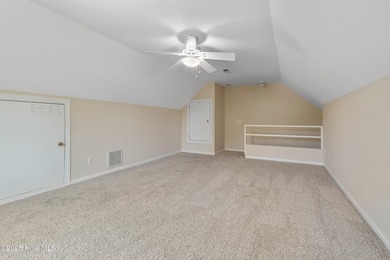 Experience coastal living in this charming 3-bedroom, 2-bath on Members Club At St. James Plantation in North Carolina - for sale on GolfHomes.com, golf home, golf lot