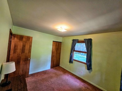 This charming 3-bedroom, 1-bath chalet-style home offers a on Birch Pointe Golf Club in Michigan - for sale on GolfHomes.com, golf home, golf lot