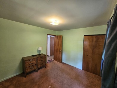 This charming 3-bedroom, 1-bath chalet-style home offers a on Birch Pointe Golf Club in Michigan - for sale on GolfHomes.com, golf home, golf lot
