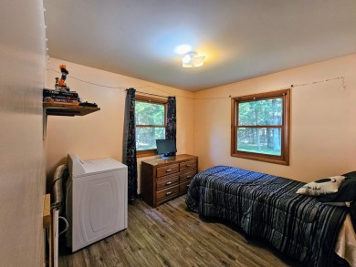 This charming 3-bedroom, 1-bath chalet-style home offers a on Birch Pointe Golf Club in Michigan - for sale on GolfHomes.com, golf home, golf lot