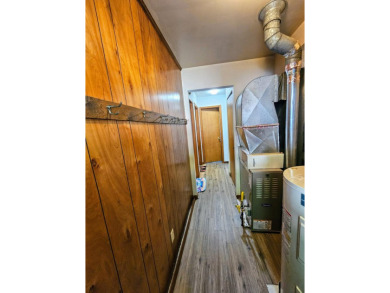 This charming 3-bedroom, 1-bath chalet-style home offers a on Birch Pointe Golf Club in Michigan - for sale on GolfHomes.com, golf home, golf lot