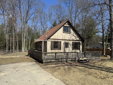 This charming 3-bedroom, 1-bath chalet-style home offers a on Birch Pointe Golf Club in Michigan - for sale on GolfHomes.com, golf home, golf lot