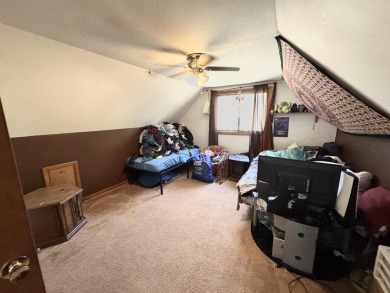 This charming 3-bedroom, 1-bath chalet-style home offers a on Birch Pointe Golf Club in Michigan - for sale on GolfHomes.com, golf home, golf lot