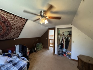 This charming 3-bedroom, 1-bath chalet-style home offers a on Birch Pointe Golf Club in Michigan - for sale on GolfHomes.com, golf home, golf lot