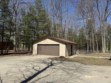 This charming 3-bedroom, 1-bath chalet-style home offers a on Birch Pointe Golf Club in Michigan - for sale on GolfHomes.com, golf home, golf lot