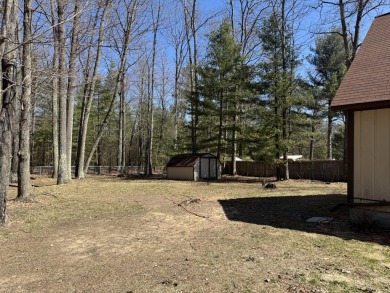 This charming 3-bedroom, 1-bath chalet-style home offers a on Birch Pointe Golf Club in Michigan - for sale on GolfHomes.com, golf home, golf lot