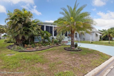 Welcome to Barefoot Bay! This 2 bedroom, 2 bath home is walking on Barefoot Bay Golf Course in Florida - for sale on GolfHomes.com, golf home, golf lot