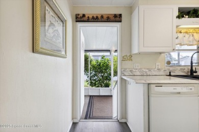 Welcome to Barefoot Bay! This 2 bedroom, 2 bath home is walking on Barefoot Bay Golf Course in Florida - for sale on GolfHomes.com, golf home, golf lot