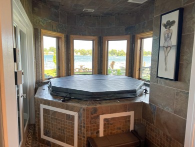 Discover unparalleled luxury on this exclusive private island on Battle Creek Country Club in Michigan - for sale on GolfHomes.com, golf home, golf lot