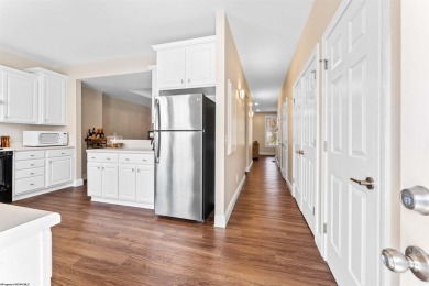 This bright, updated unit features new LVP flooring and a porch on Lakeview Golf Resort and Spa - Lakeview in West Virginia - for sale on GolfHomes.com, golf home, golf lot