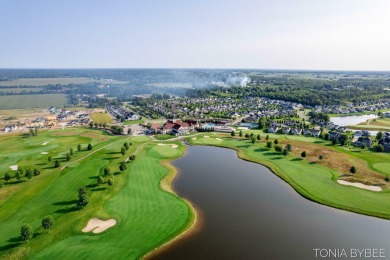 Location, location, location! This wonderful home is located in on The Macatwa Legends Golf Course in Michigan - for sale on GolfHomes.com, golf home, golf lot