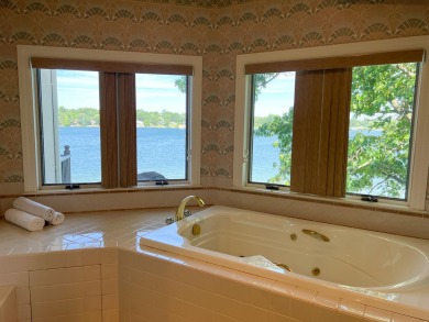 Discover unparalleled luxury on this exclusive private island on Battle Creek Country Club in Michigan - for sale on GolfHomes.com, golf home, golf lot