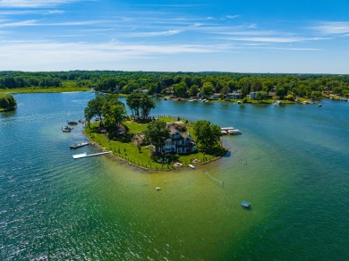 Discover unparalleled luxury on this exclusive private island on Battle Creek Country Club in Michigan - for sale on GolfHomes.com, golf home, golf lot