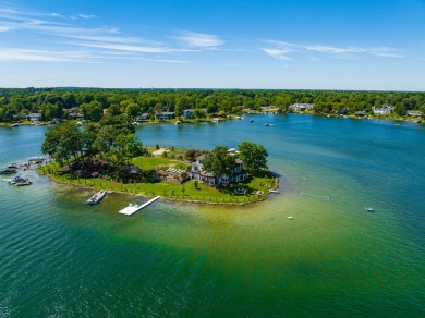 Discover unparalleled luxury on this exclusive private island on Battle Creek Country Club in Michigan - for sale on GolfHomes.com, golf home, golf lot