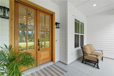 Experience Coastal Georgia Living in the luxurious Riverfront on The Golf Club At Sanctuary Cove in Georgia - for sale on GolfHomes.com, golf home, golf lot