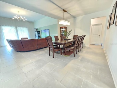 Built in 2024, this 4 bedroom / 3 bathroom Newcastle model on The Oasis Club at Champions Gate in Florida - for sale on GolfHomes.com, golf home, golf lot