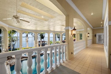 Tucked within the gates of Isleworth Golf Community and Country on Isleworth Golf and Country Club in Florida - for sale on GolfHomes.com, golf home, golf lot
