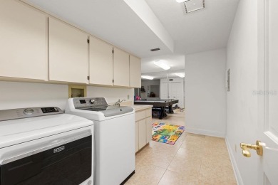 Tucked within the gates of Isleworth Golf Community and Country on Isleworth Golf and Country Club in Florida - for sale on GolfHomes.com, golf home, golf lot