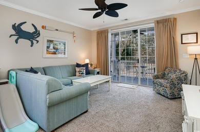 Two-bedroom two bath fully furnished second floor end unit in on Barefoot Resort and Golf Club  in South Carolina - for sale on GolfHomes.com, golf home, golf lot