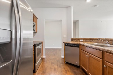 Looking for a first-floor condo with an attached garage that on Stone Creek Golf Club in Illinois - for sale on GolfHomes.com, golf home, golf lot