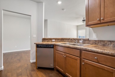 Looking for a first-floor condo with an attached garage that on Stone Creek Golf Club in Illinois - for sale on GolfHomes.com, golf home, golf lot