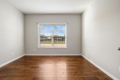 Looking for a first-floor condo with an attached garage that on Stone Creek Golf Club in Illinois - for sale on GolfHomes.com, golf home, golf lot