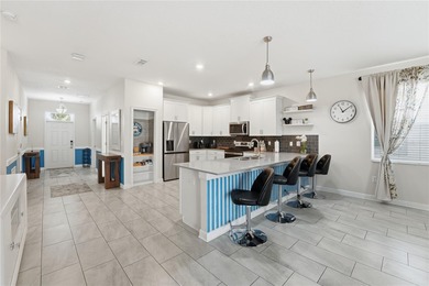 Overhauled by  Superhosts and designed for five-star stays -- on The Oasis Club at Champions Gate in Florida - for sale on GolfHomes.com, golf home, golf lot