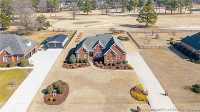 This beautifully updated custom brick home is located on Hole #1 on Sandy Ridge Country Club in North Carolina - for sale on GolfHomes.com, golf home, golf lot