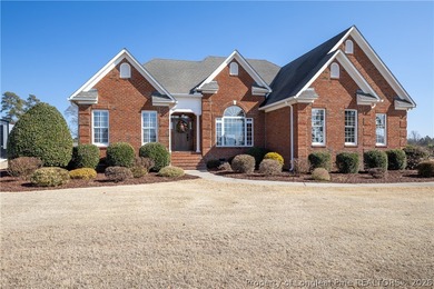 This beautifully updated custom brick home is located on Hole #1 on Sandy Ridge Country Club in North Carolina - for sale on GolfHomes.com, golf home, golf lot