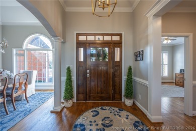 This beautifully updated custom brick home is located on Hole #1 on Sandy Ridge Country Club in North Carolina - for sale on GolfHomes.com, golf home, golf lot