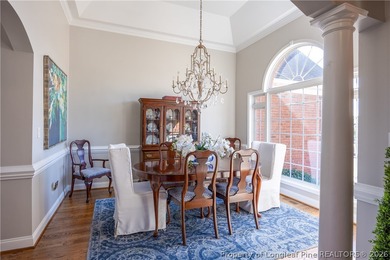 This beautifully updated custom brick home is located on Hole #1 on Sandy Ridge Country Club in North Carolina - for sale on GolfHomes.com, golf home, golf lot