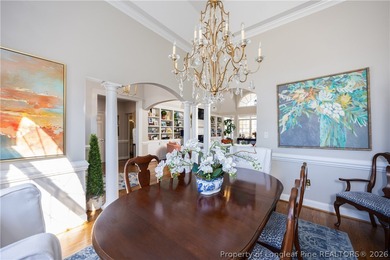 This beautifully updated custom brick home is located on Hole #1 on Sandy Ridge Country Club in North Carolina - for sale on GolfHomes.com, golf home, golf lot