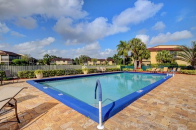 This beautiful 2nd-floor corner unit in Fairways Green, Boca on Boca Lago Golf and Country Club in Florida - for sale on GolfHomes.com, golf home, golf lot