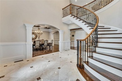 Positioned on a quiet cul-de-sac overlooking the 17th green on TPC At Sugarloaf Golf Club in Georgia - for sale on GolfHomes.com, golf home, golf lot