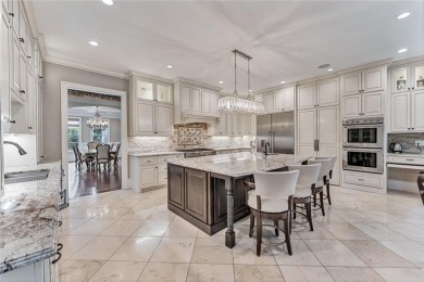 Positioned on a quiet cul-de-sac overlooking the 17th green on TPC At Sugarloaf Golf Club in Georgia - for sale on GolfHomes.com, golf home, golf lot