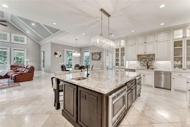 Positioned on a quiet cul-de-sac overlooking the 17th green on TPC At Sugarloaf Golf Club in Georgia - for sale on GolfHomes.com, golf home, golf lot