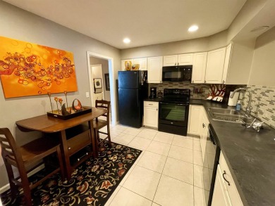 Welcome to 49 E Via Roma, a refined 2-bedroom, 3-bath townhome on Crestview Country Club in Kansas - for sale on GolfHomes.com, golf home, golf lot
