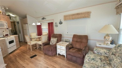 PET FRIENDLY, SINGLE WIDE MOBILE HOME IN ACTIVE 55+ COMMUNITY! on River Run Golf Links in Florida - for sale on GolfHomes.com, golf home, golf lot