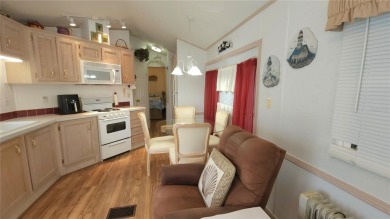 PET FRIENDLY, SINGLE WIDE MOBILE HOME IN ACTIVE 55+ COMMUNITY! on River Run Golf Links in Florida - for sale on GolfHomes.com, golf home, golf lot