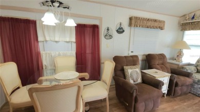 PET FRIENDLY, SINGLE WIDE MOBILE HOME IN ACTIVE 55+ COMMUNITY! on River Run Golf Links in Florida - for sale on GolfHomes.com, golf home, golf lot