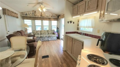 PET FRIENDLY, SINGLE WIDE MOBILE HOME IN ACTIVE 55+ COMMUNITY! on River Run Golf Links in Florida - for sale on GolfHomes.com, golf home, golf lot