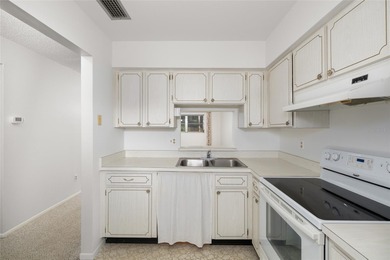 Tucked at the end of the road in Pinehurst Village, this on The Dunedin Country Club in Florida - for sale on GolfHomes.com, golf home, golf lot