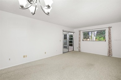 Tucked at the end of the road in Pinehurst Village, this on The Dunedin Country Club in Florida - for sale on GolfHomes.com, golf home, golf lot