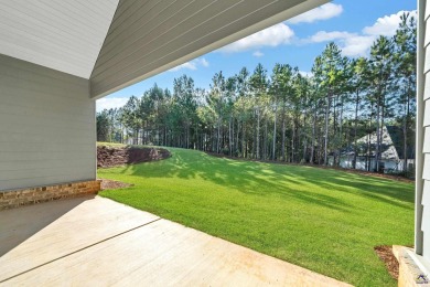 Nestled on the corner lot is an absolute gorgeous new on Canongate At Healy Point Country Club in Georgia - for sale on GolfHomes.com, golf home, golf lot