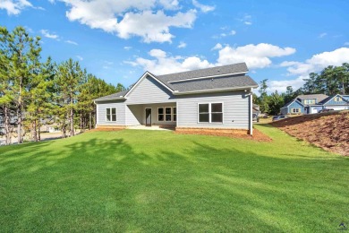 Nestled on the corner lot is an absolute gorgeous new on Canongate At Healy Point Country Club in Georgia - for sale on GolfHomes.com, golf home, golf lot