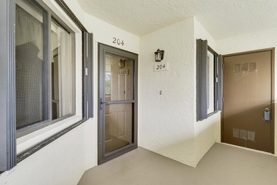 Enjoy panoramic golf and lake views from this 2 bedroom, 2 bath on  in Florida - for sale on GolfHomes.com, golf home, golf lot