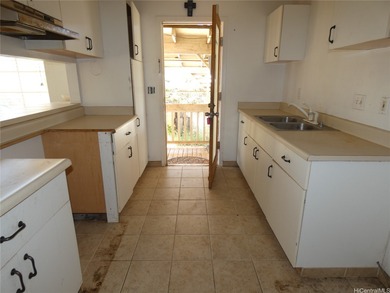 Situated on a nicely sized flag lot in Ewa Villages close to on Coral Creek Golf Course in Hawaii - for sale on GolfHomes.com, golf home, golf lot